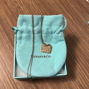 Tiffany & Co. Nike Women’s Marathon sterling silver necklace.